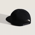 Black cap on a light beige background