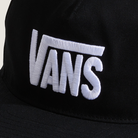 Black cap with white 'Vans' logo on a light gray background