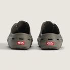 Two gray shoes with red Vans labels on a light gray background
