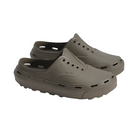 Pair of brown clogs on a light gray background