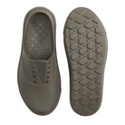 Gray slip-on shoe with textured sole on a light gray background