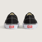 Rear view of Vans Authentic Shoes in Black and White highlighting the iconic Vans heel tab and classic vulcanized construction.