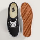 Top and bottom view of the Vans Authentic Shoe in Black and White displaying the lace-up canvas upper and signature waffle tread outsole.