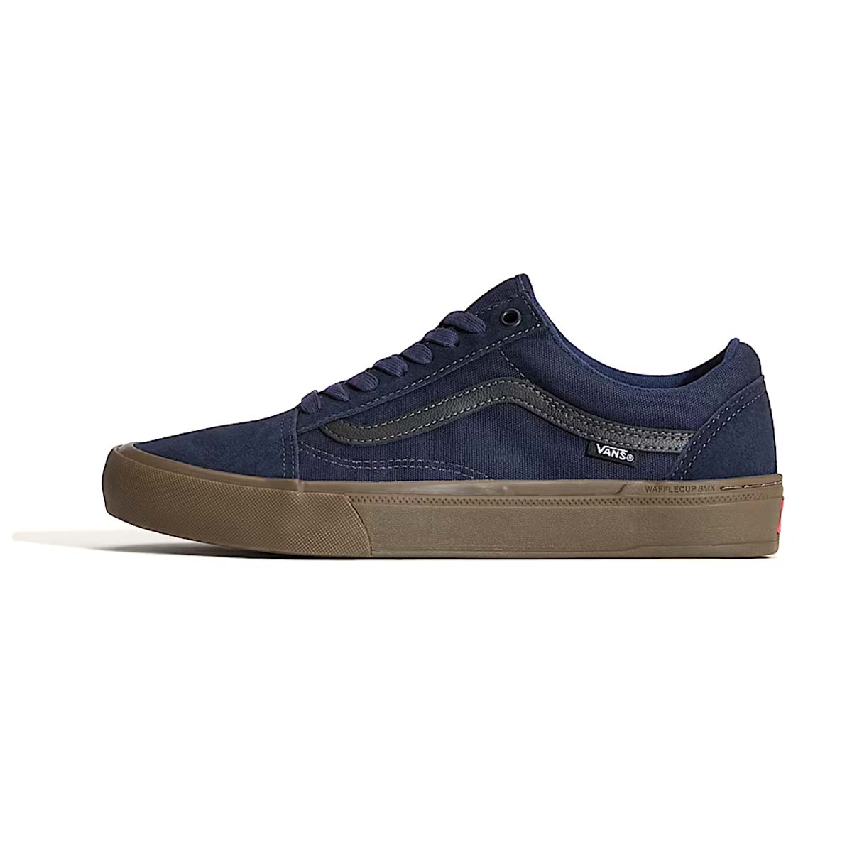 Product shot of the Vans BMX Old Skool in Parisian Night, a deep blue low-top BMX shoe with gum sole, featuring Wafflecup™ technology for pedal feel, DURACAP™ reinforcements for durability, and PopCush™ footbeds for impact protection. Designed for BMX and MTB riders needing grip, support, and long-lasting performance.