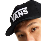 Person wearing the black Vans Drop V Snapback Hat, showcasing classic 5-panel fit with curved bill and embroidered Drop V logo for everyday off-duty style