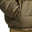 Close up view of the Vans Hillgate Puffer Jacket in Bungee Cord brown showing the pocket detail with 10 oz insulated construction and recycled polyester shell designed for cold weather comfort and daily wear.