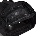 Vans Omit Backpack shown unzipped while laid on its side displaying the interior pockets, mesh organizers, and padded laptop sleeve inside the rugged Cordura 28 liter main compartment built for daily carry and mission ready use.