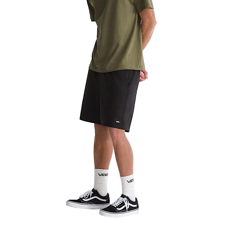 Model wearing Vans Range Sport Shorts in Black, showcasing the lightweight athletic fit, elastic waistband, and versatile everyday performance design.
