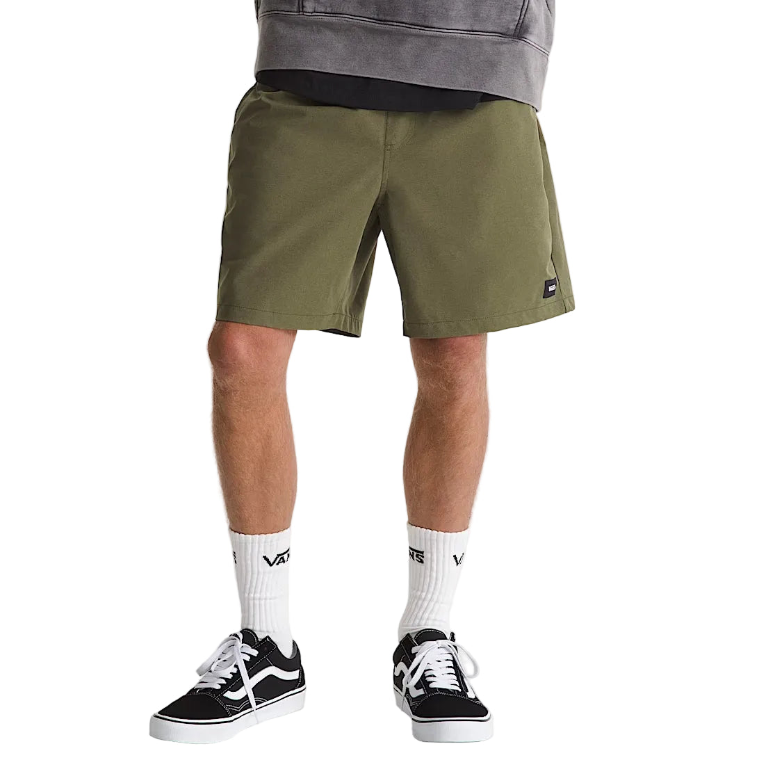 Model wearing Vans Range Sport Shorts in Mossy Olive, demonstrating the lightweight fit and versatile activewear styling.