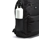 Close-up of the mesh water bottle holder on the black Vans Startle Backpack, designed for off-duty use with easy-access storage and rugged everyday performance