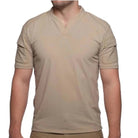 Front view of the Velocity Systems BOSS Rugby Short Sleeve Combat Shirt in Tan, a USA-made tactical range top built for sheriff and law enforcement use. Features 4-way stretch nylon-spandex, UV protection, and moisture-wicking tech for duty and training.