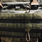 Velocity Systems Tourniquet Retainer mounted to MOLLE webbing and securing a CAT tourniquet for immediate access during tactical, medical, and field operations.