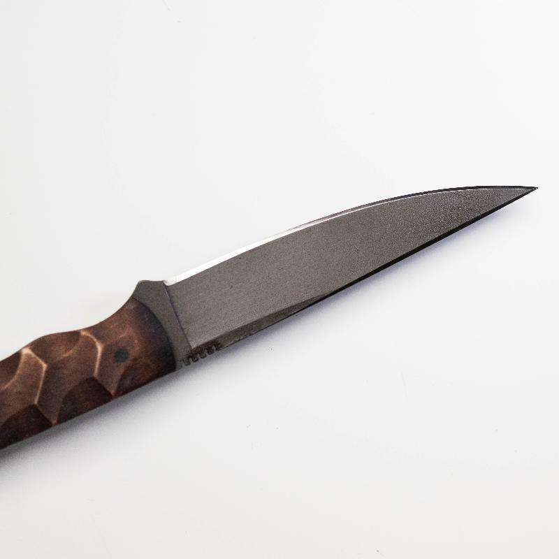 Close up of Winkler WK Operator Knife blade showing black oxide no glare finish, thumb index file work, and precision edge geometry