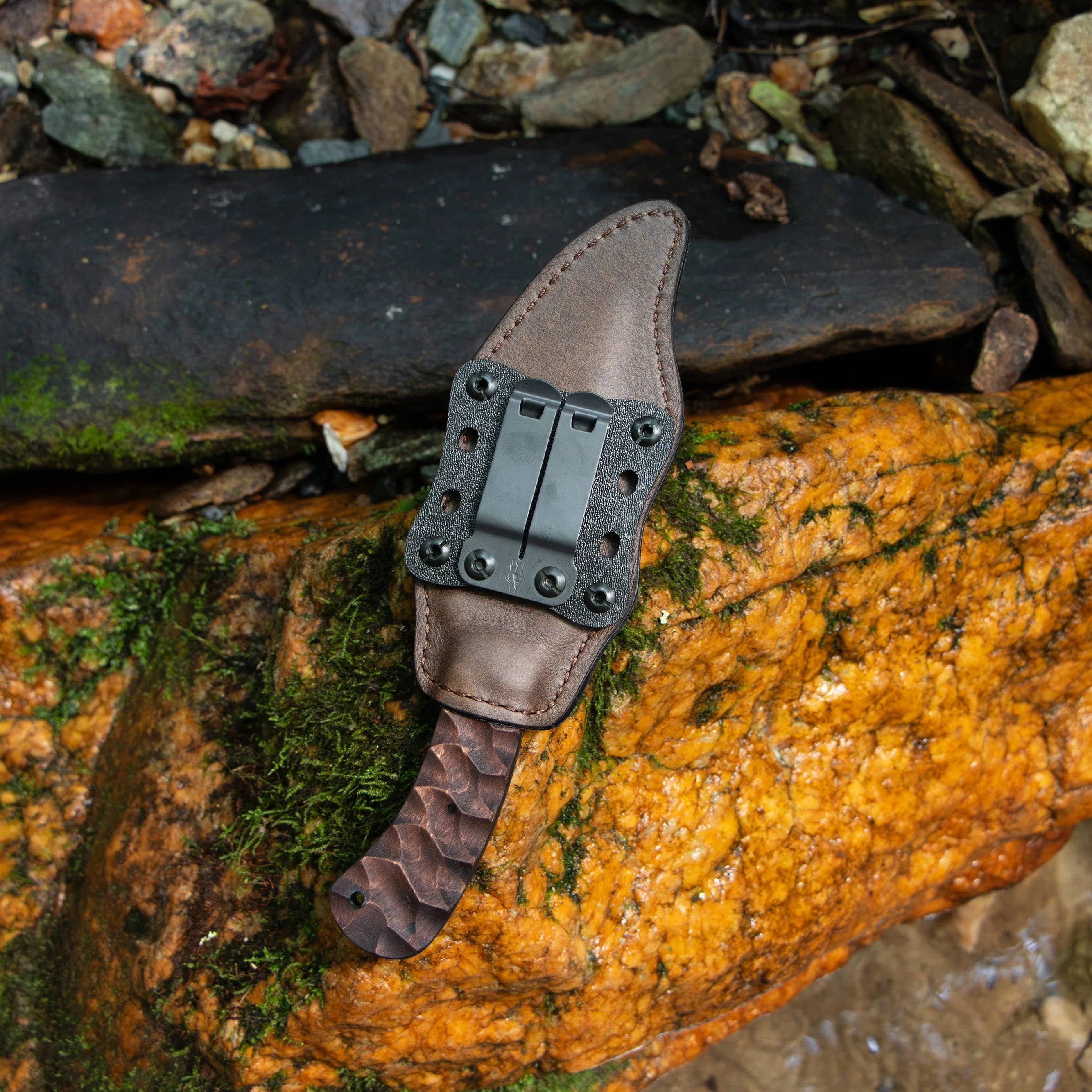 Close up of Discreet Carry Concepts spring steel belt clip on Winkler Belt Knife Walnut Sculpted sheath for secure horizontal or vertical carry