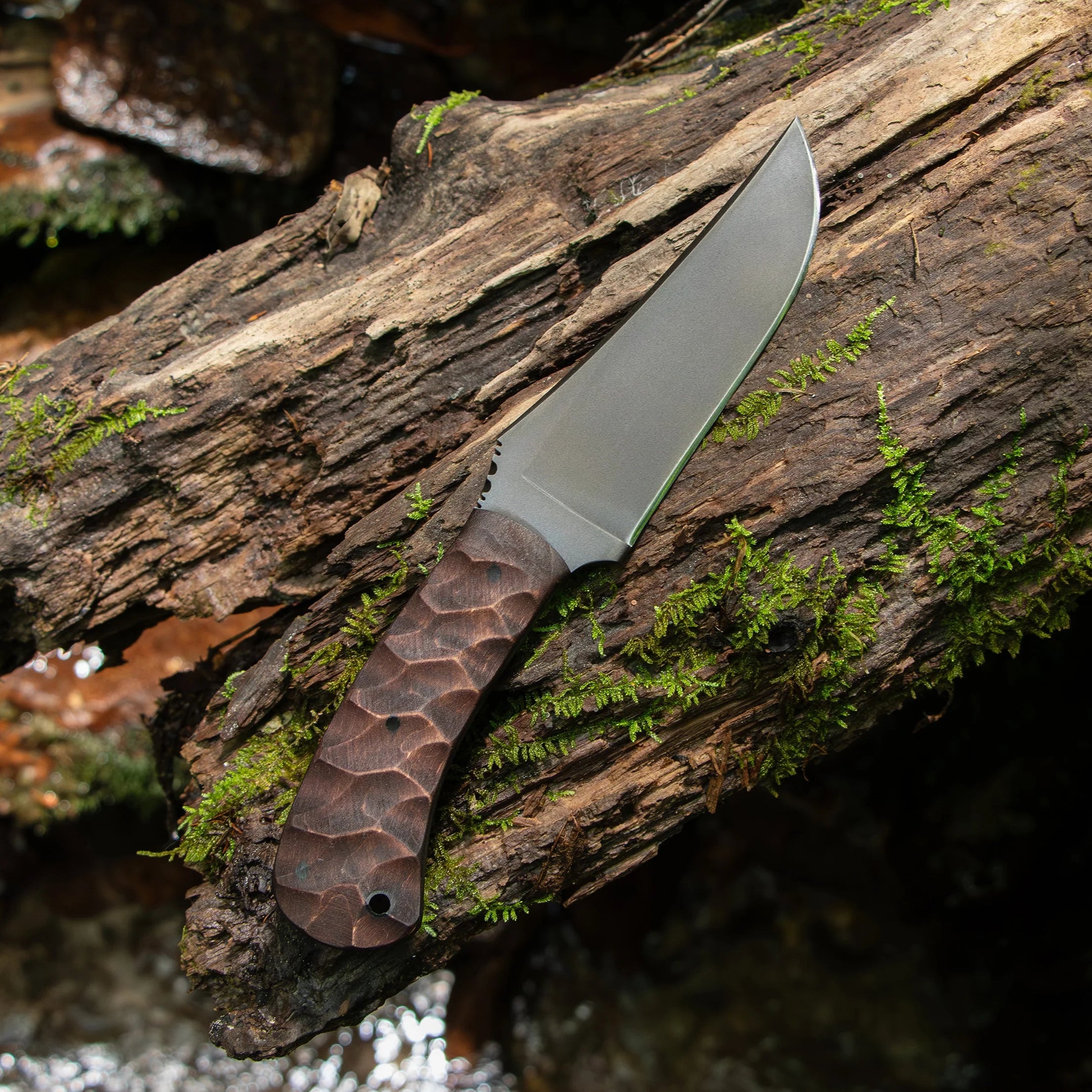 Close up of sculpted walnut handle on Winkler Belt Knife showing ergonomic contouring and secure grip for field and tactical applications