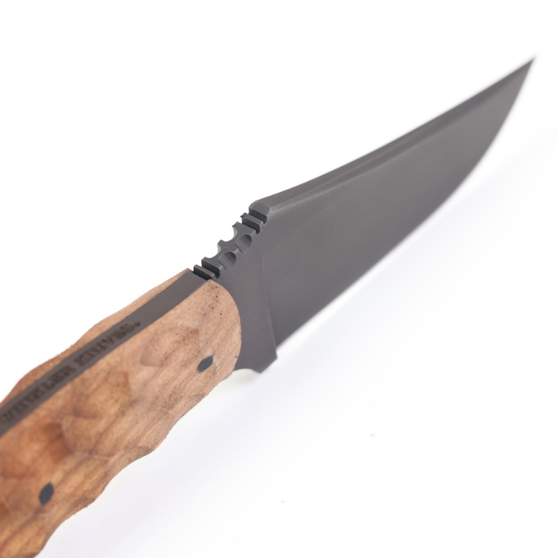 Close up of contoured walnut handle scales on Winkler Blue Ridge Crusher fixed blade highlighting ergonomic grip design