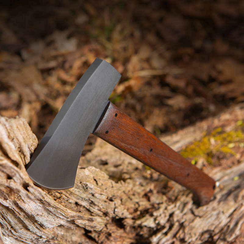 Winkler Highland Hatchet walnut compact survival axe positioned in backcountry or truck kit setup for chopping, splitting, and utility tasks