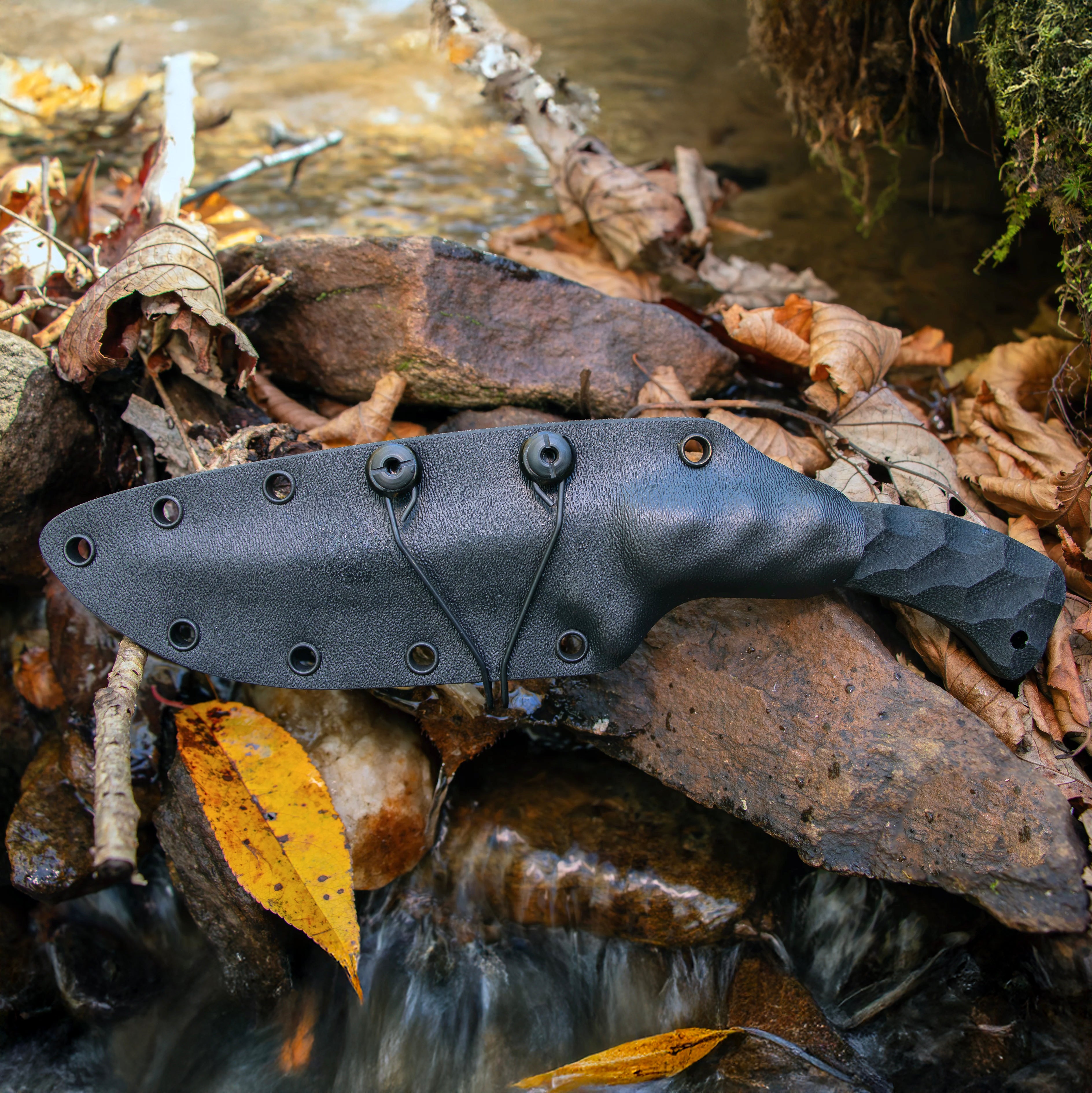 Close view of Winkler Shadow Strike sculpted black laminate version seated in Boltaron sheath with Ulti Clip for inside waistband concealed carry