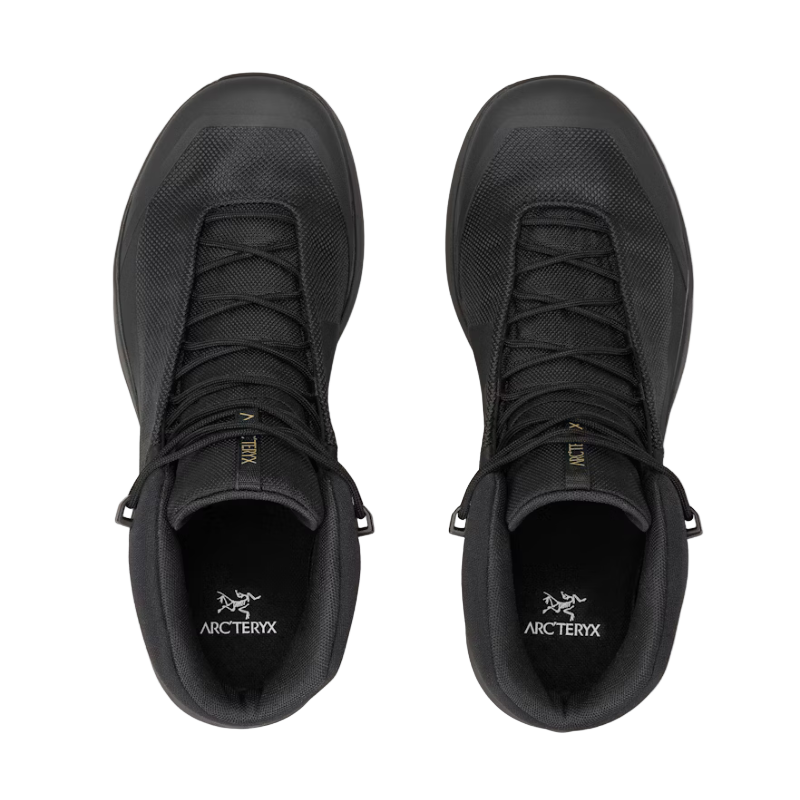 Black Arcteryx shoes on a light gray background