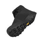 Black boot with a textured sole on a light gray background