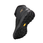 Black hiking shoe with an Arc'teryx Dead Bird brand logo in yellow on a light gray background