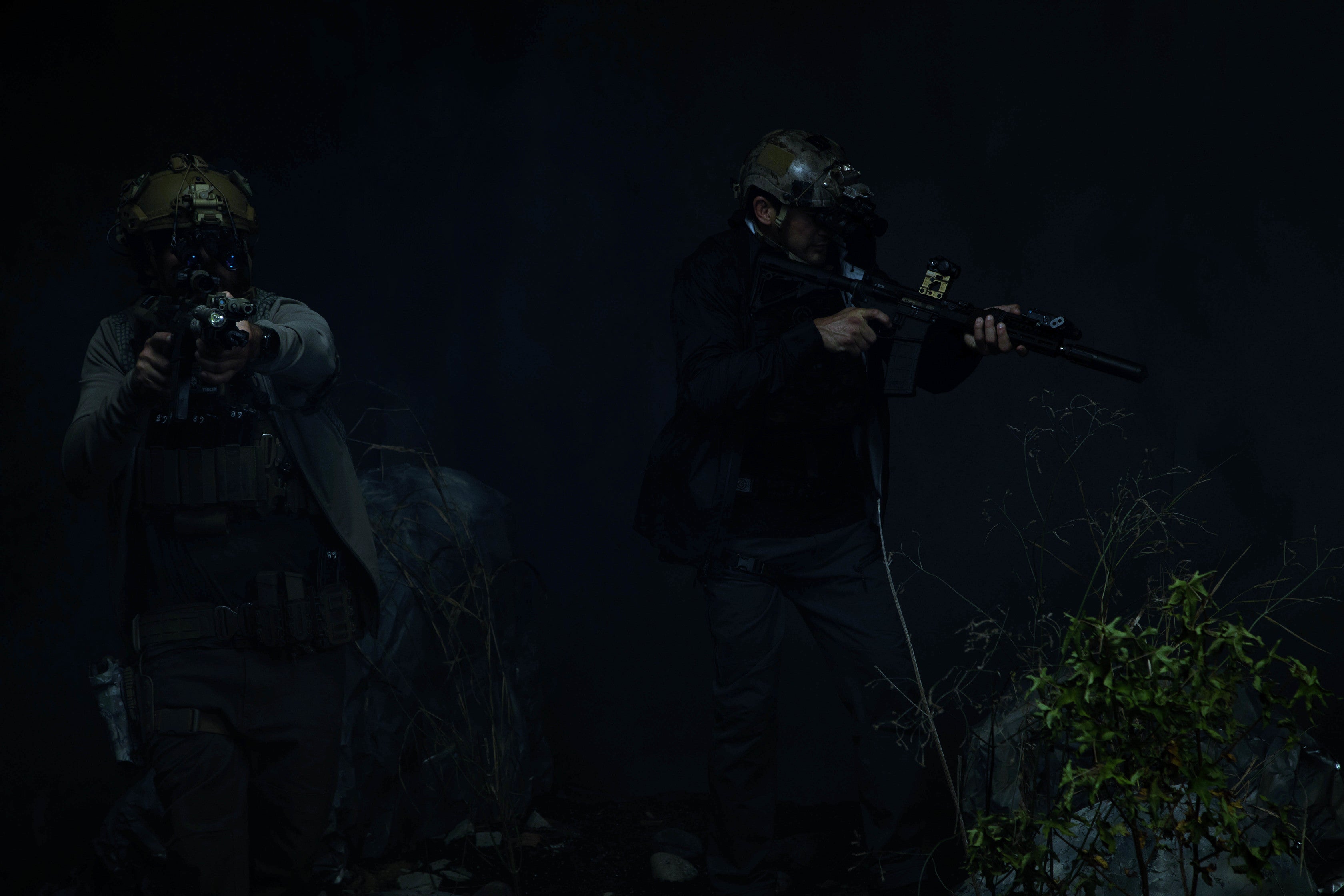 Men using scopes and tactical gear at night