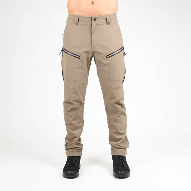 Man wearing field pants in Flat Dark Earth tan color from MTHD's Basin Tweave Durastretch line