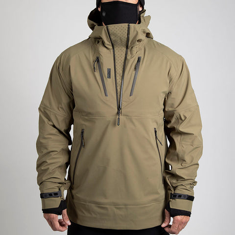 Man wearing hardshell jacket in Burnt Olive color from MTHD Tundra Polartec NeoShell 3L Anorak line