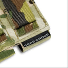Close up of the GBRS Group tag on the Multicam Double Pistol Magazine Pouch, showing the stitched branding, rugged Squadron laminate material, and precision construction designed for professional tactical use.