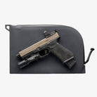 Magpul DAKA Single Pistol Case Black shown with full size handgun resting on top for size reference and compact soft case storage comparison