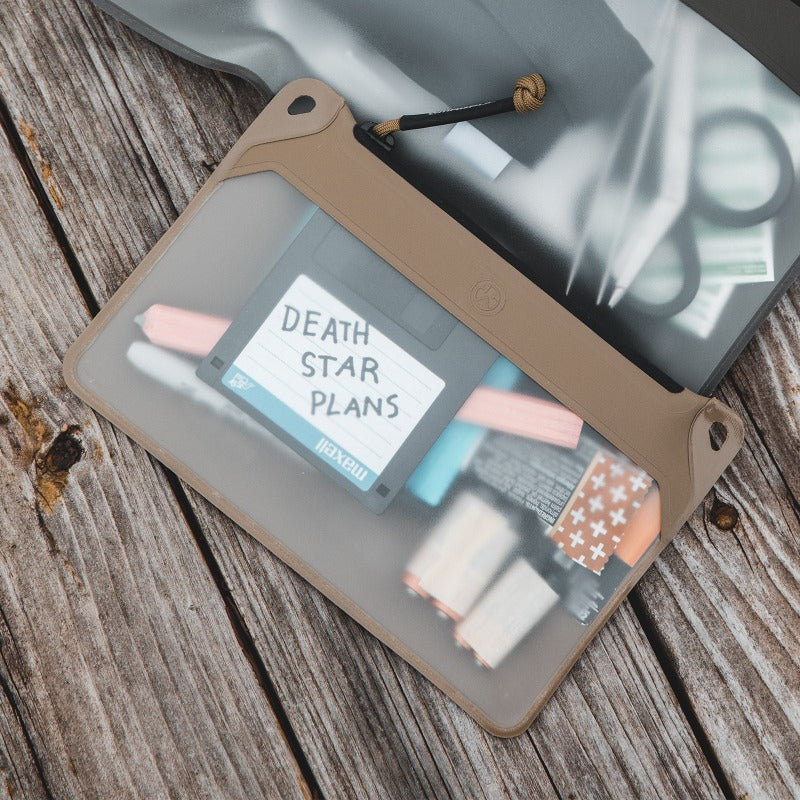 Magpul DAKA Window Pouch Small Flat Dark Earth holding compact gear visible through clear window