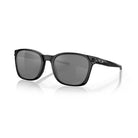 Angled front view of Oakley SI Ojector sunglasses featuring a Matte Black frame, Prizm Grey Polarized lenses, and a lightweight Ahyris-inspired design.