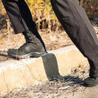 Salomon XA Forces 8 Inch GTX boots navigating urban obstacles, showcasing stability, traction, and high-cut support during movement.