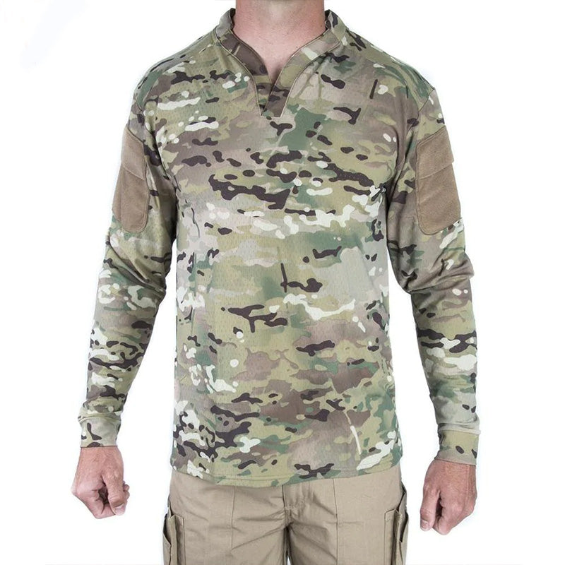 Product shot of the Velocity Systems BOSS Rugby Long Sleeve Combat Shirt in MultiCam, the ultimate tactical range top and operator base layer for military and law enforcement use. Built from 4-way stretch nylon-spandex with moisture-wicking performance, Odorexx™ antimicrobial treatment, and UV protection, this long sleeve combat shirt is made in the USA for duty, range, and field operations. Featuring dual sleeve pockets with loop panels and a modern low-profile collar for compatibility with plate carriers,