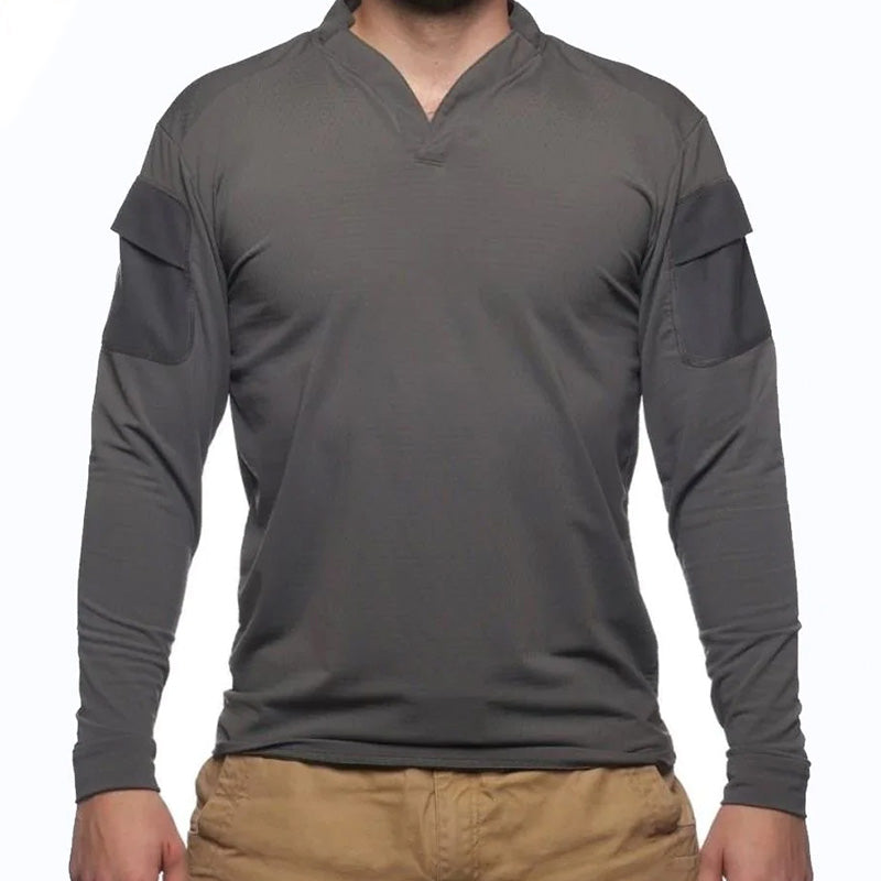 Product shot of the Velocity Systems BOSS Rugby Long Sleeve Combat Shirt in Wolf Grey, a high-performance tactical range top built for law enforcement, military, and professional training environments. Made in the USA from 4-way stretch nylon-spandex, this long sleeve combat base layer offers moisture wicking, UV protection, and Odorexx™ antimicrobial control for hot-weather missions. Featuring dual sleeve pockets with loop panels, a modern low-profile collar, and athletic fit, the BOSS Rugby in Wolf Grey d